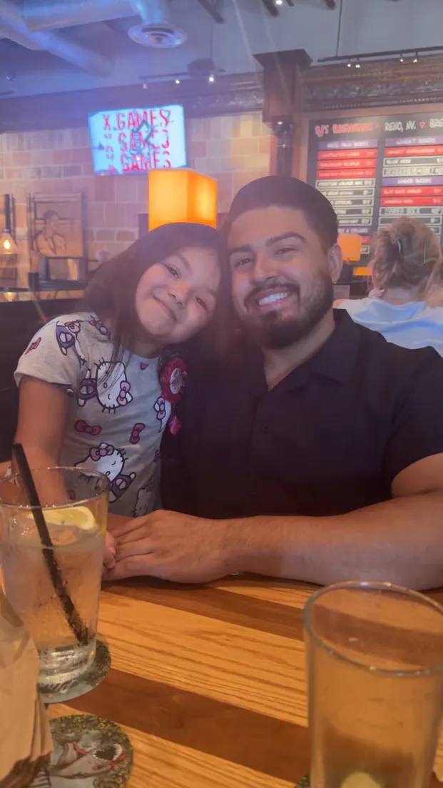 Coach AJ with his daughter